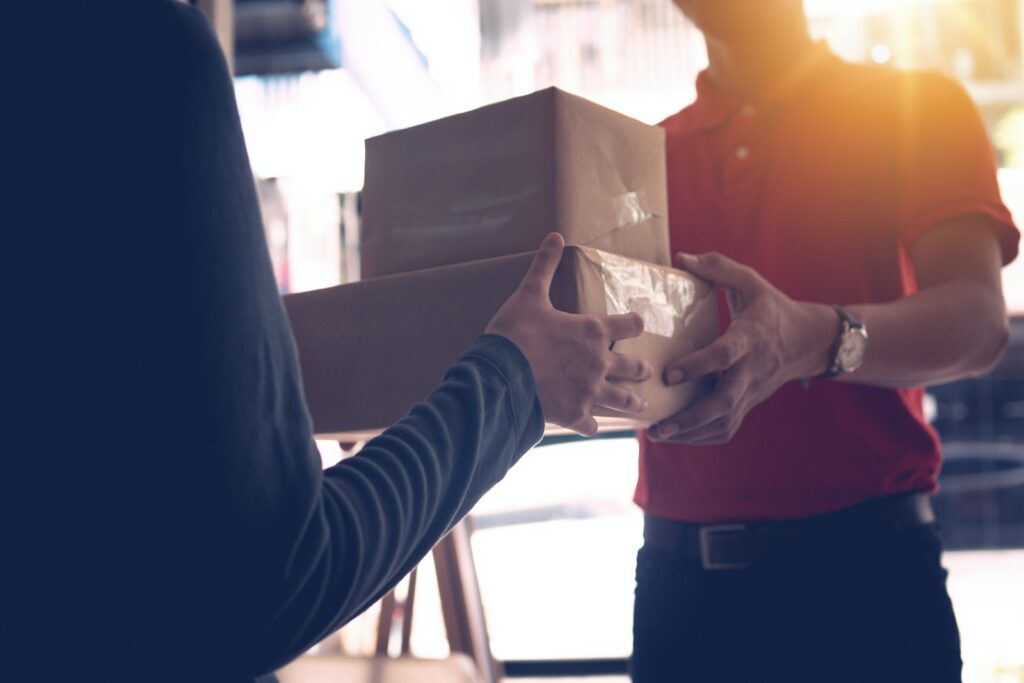 Man Delivering Packages To A Person